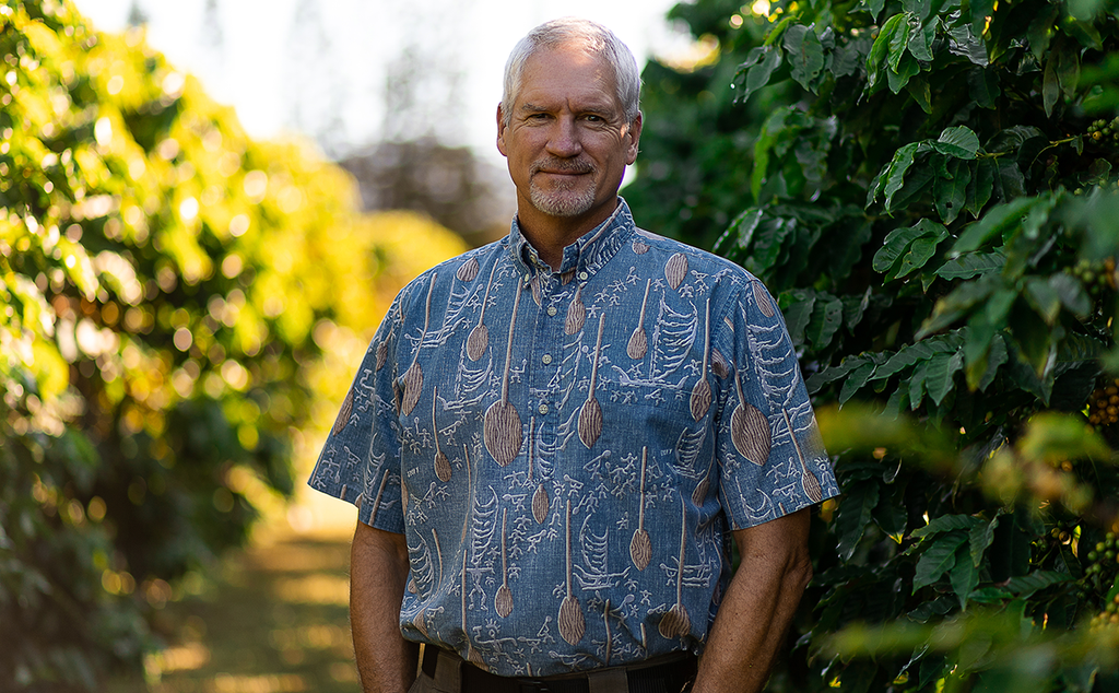 Kauai Coffee General Manager Fred Cowell, aerial view of kauai coffee farm., Kauai Coffee field staff exams tree in the orchard, Planting seedlings at the Kauai Coffee nursery